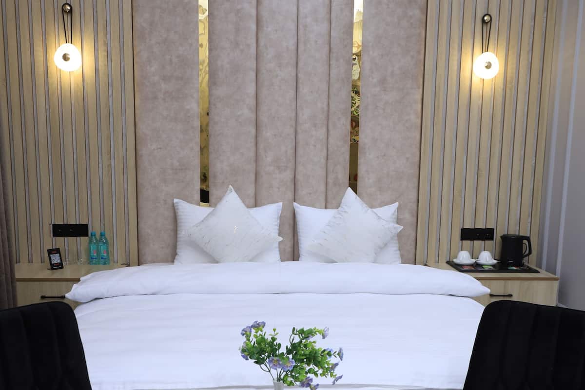 Deluxe Room, City View | In-room safe, desk, laptop workspace, soundproofing