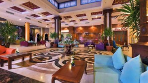 A spacious lobby with a central coffee table, seating area, and a reception desk. - Spacious Resort Beach Villa with Private Pool Nabq (South Sinai Governorate)