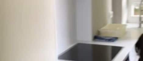 Fridge, stovetop, dishwasher, coffee/tea maker