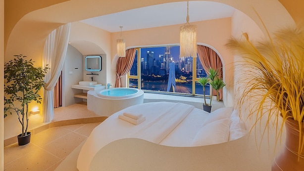 A modern bedroom with a large bed, a bathtub, a vanity, and a city view. - Chongqing City Center River View B&B (Chongqing)
