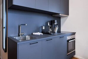 Fridge, stovetop, dishwasher, coffee/tea maker