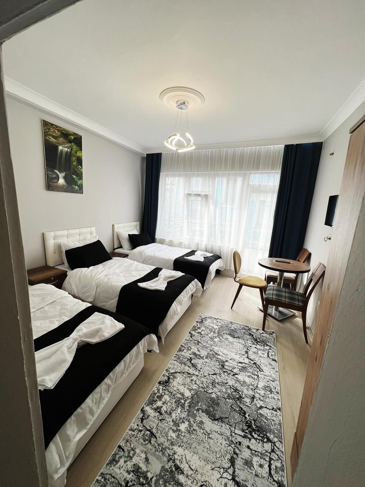 Deluxe Triple Room, Balcony | Iron/ironing board, free WiFi