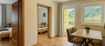 Stylish mountain apartment with terrace in Flattach near Mölltal Glacier