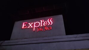 A building with a neon sign that reads "Express Food Plaza". - EXPRESS FOOD PLAZA (Kolaghat)