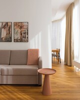 Family Suite with Sofa Bed | Living area | 50-inch flat-screen TV with cable channels