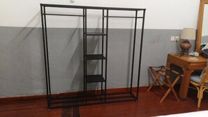 A room with a metal wardrobe, a wooden desk with a lamp, and a chair. - Heeren Street Hotel at Jonker Walk Melaka (Malacca City)