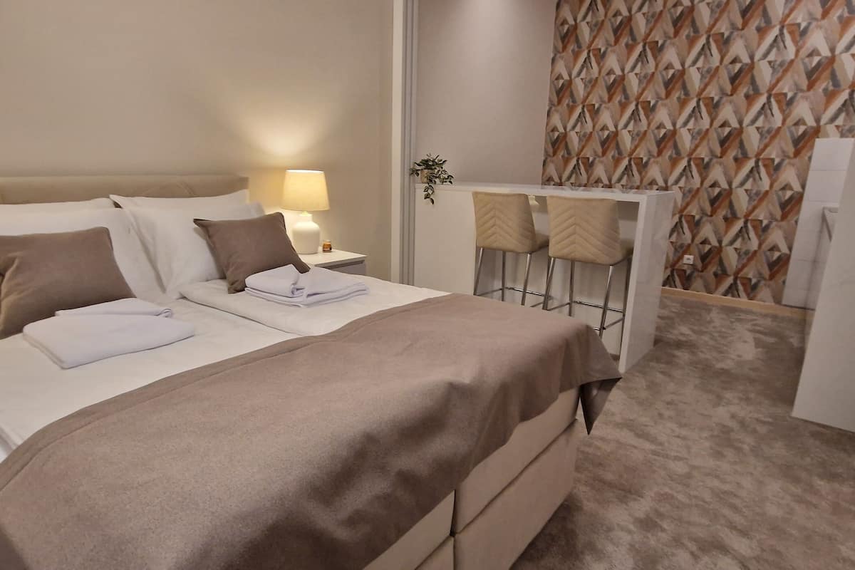 Apartment, Patio, Courtyard View | In-room safe, soundproofing, iron/ironing board, free WiFi