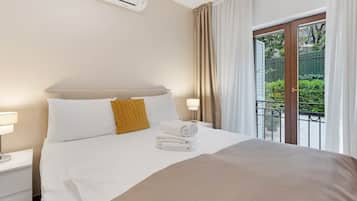 Apartment, Patio, Courtyard View | In-room safe, soundproofing, iron/ironing board, free WiFi
