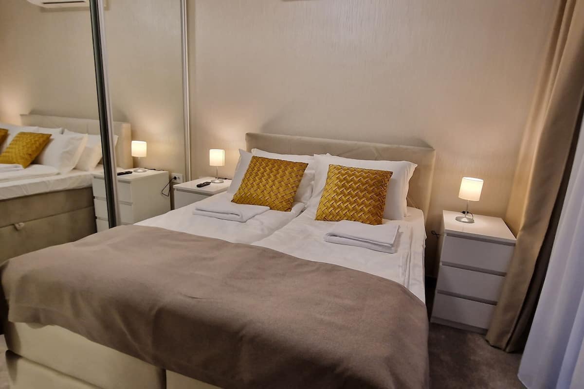 Apartment, Patio, Courtyard View | In-room safe, soundproofing, iron/ironing board, free WiFi