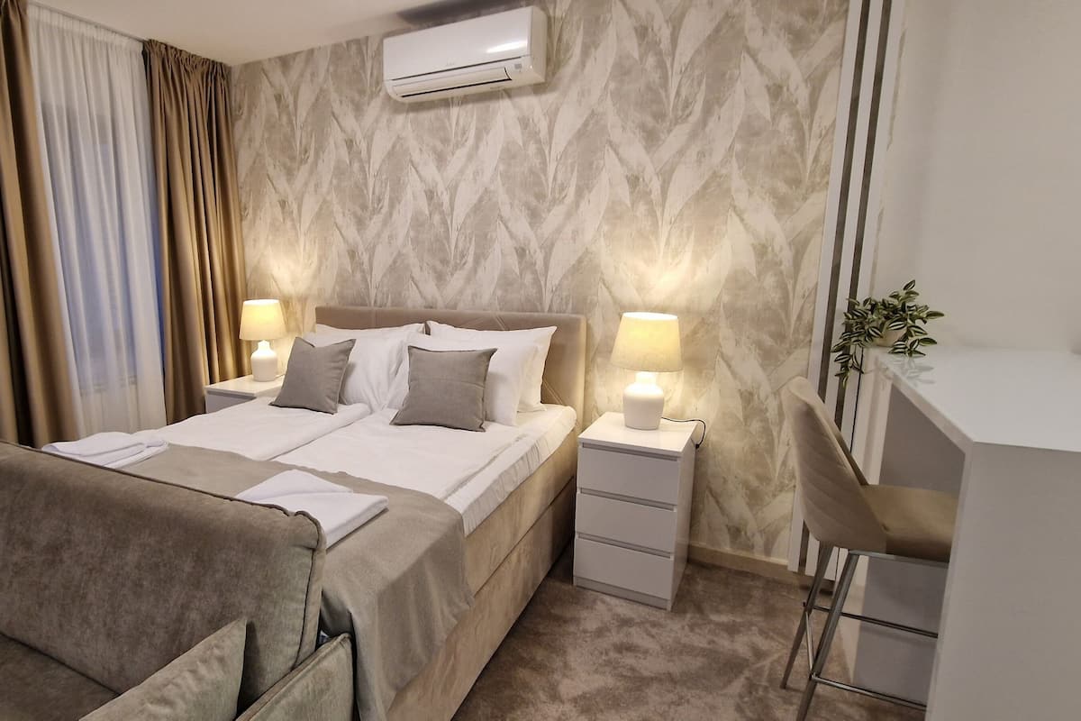 Apartment, Patio, Courtyard View | In-room safe, soundproofing, iron/ironing board, free WiFi