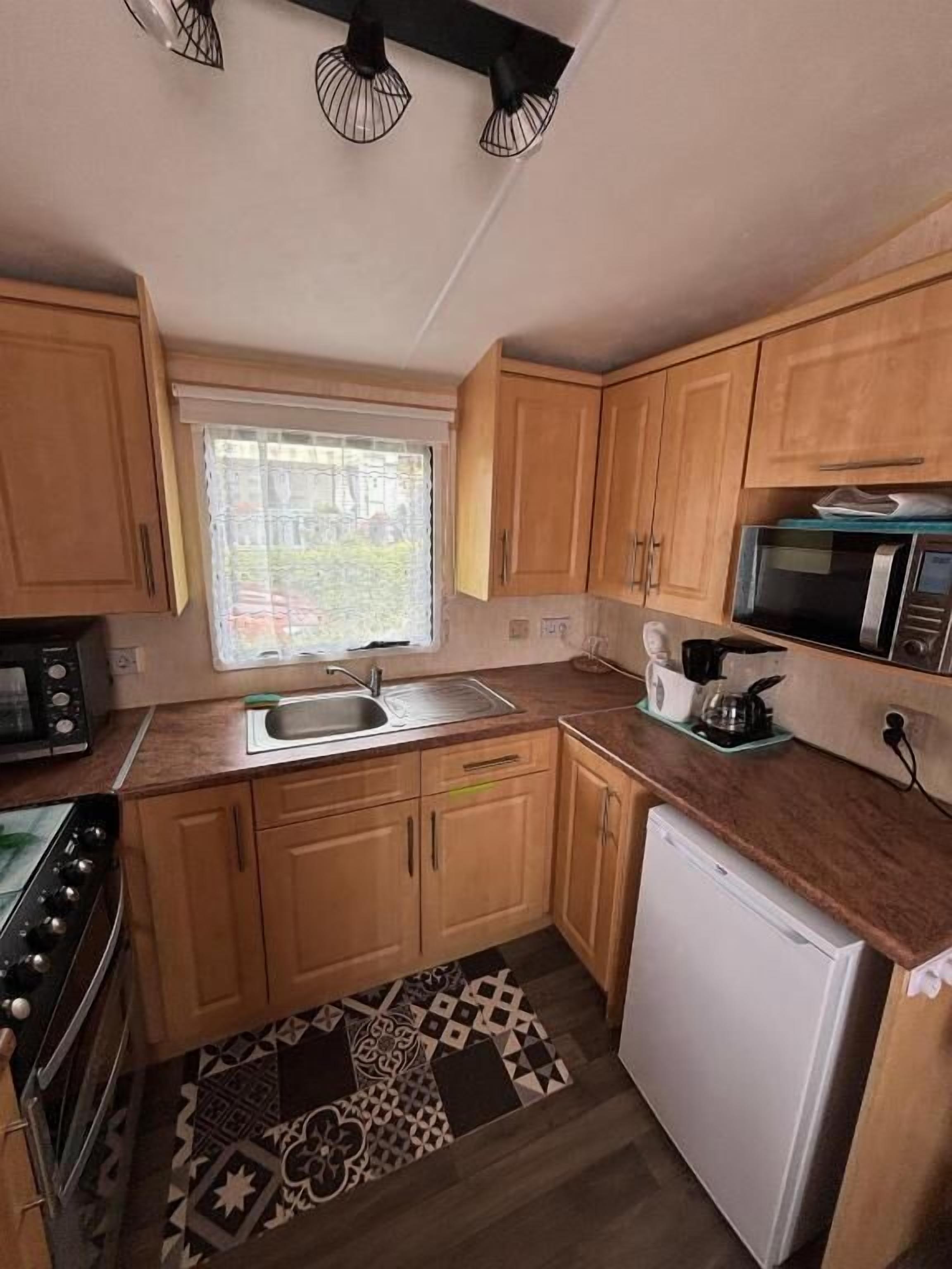 Casa rodante, vista al jardín | Cocina privada | Periquera 