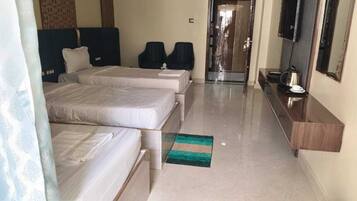 Premium Triple Room, Hill View | Desk, laptop workspace, free WiFi