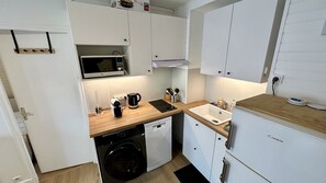 Apartment | Private kitchen | Highchair - Sunny Sanctuary by the Town Center (Mont-Dore)