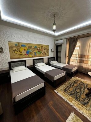 Deluxe Triple Room, Courtyard View | In-room safe, desk, soundproofing, iron/ironing board - Altair Boutique (Samarkand)