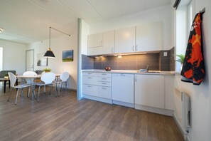 Apartment, 2 Bedrooms, Mobility Accessible, Courtyard View | Private kitchen | Full-sized fridge, microwave, oven, stovetop - Feriecenter Slettestrand (Fjerritslev)