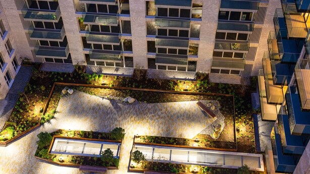 A modern high-rise building with multiple balconies and a rooftop garden area. - The Oslo by Dublin At Home (Dublin)