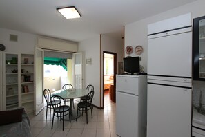 Apartment, 2 Bedrooms, Balcony | Dining room - Comfy Flat by the Beach (San Michele al Tagliamento)