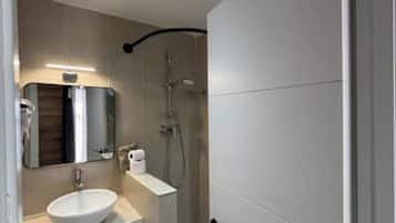 Shower, eco-friendly toiletries, hair dryer, towels