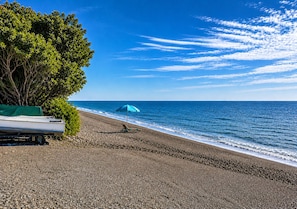 On the beach, sun loungers