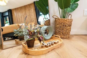 A wooden tray with potted plants and a woven basket on a wooden floor. - Hidden Speakeasy • Hot Tub • Sauna • Private Woods (Gatlinburg)