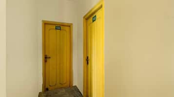 A narrow hallway with two doors, one labeled '104' and the other '103'.