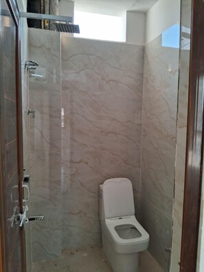 Shower, slippers, towels, soap