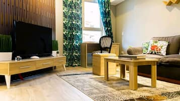 Estudio Deluxe, 1 cama King size | Área de sala de estar