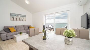Standard Apartment, Patio, Sea View | Living area