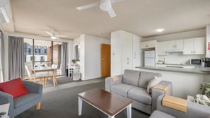A modern apartment with a living room, dining area, and kitchen. - Fountain Court 24 - Walk to Everything! The Ultimate Coastal Escape in the Heart of It All! (Port Macquarie)