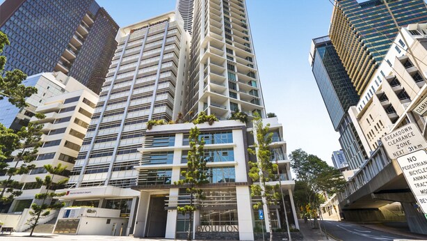 A modern high-rise building with multiple floors, large windows, and balconies. - Brisbane City Retreat With Private Balcony (Brisbane)