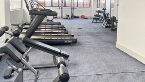 A gym with treadmills, weight machines, and free weights. - Modern studio close to JKIA and SGR Syokimau (Nairobi)