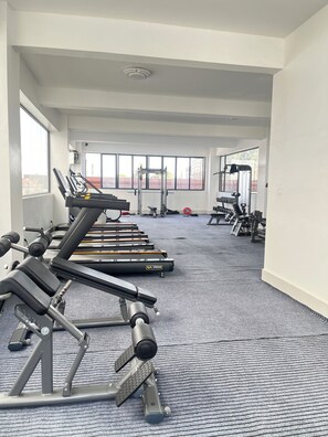 A gym with treadmills, weight machines, and free weights. - Modern studio close to JKIA and SGR Syokimau (Nairobi)