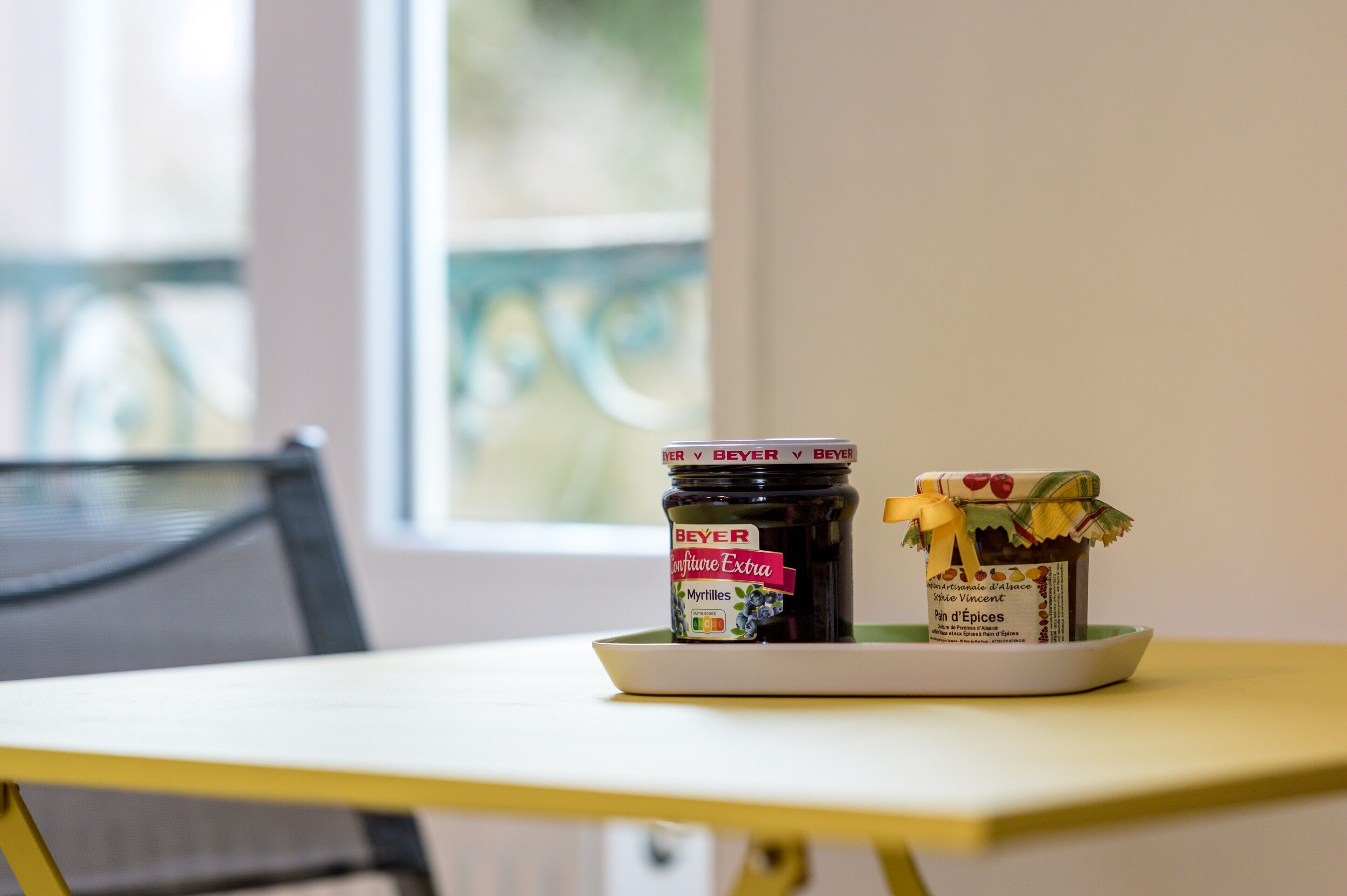 A table with two jars of food products.