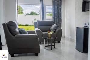 Quarto casal presidencial, vista para o jardim | Área de estar