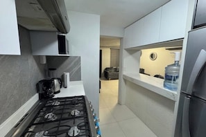 Fridge, microwave, stovetop, coffee/tea maker