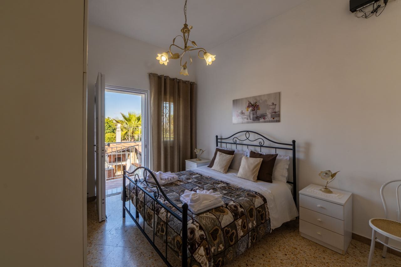 Apartment, Kitchen, City View | Desk, laptop workspace, blackout curtains, iron/ironing board