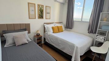 Apartamento conforto, vista parcial para o oceano | Cortinas blackout, Wi-Fi de cortesia
