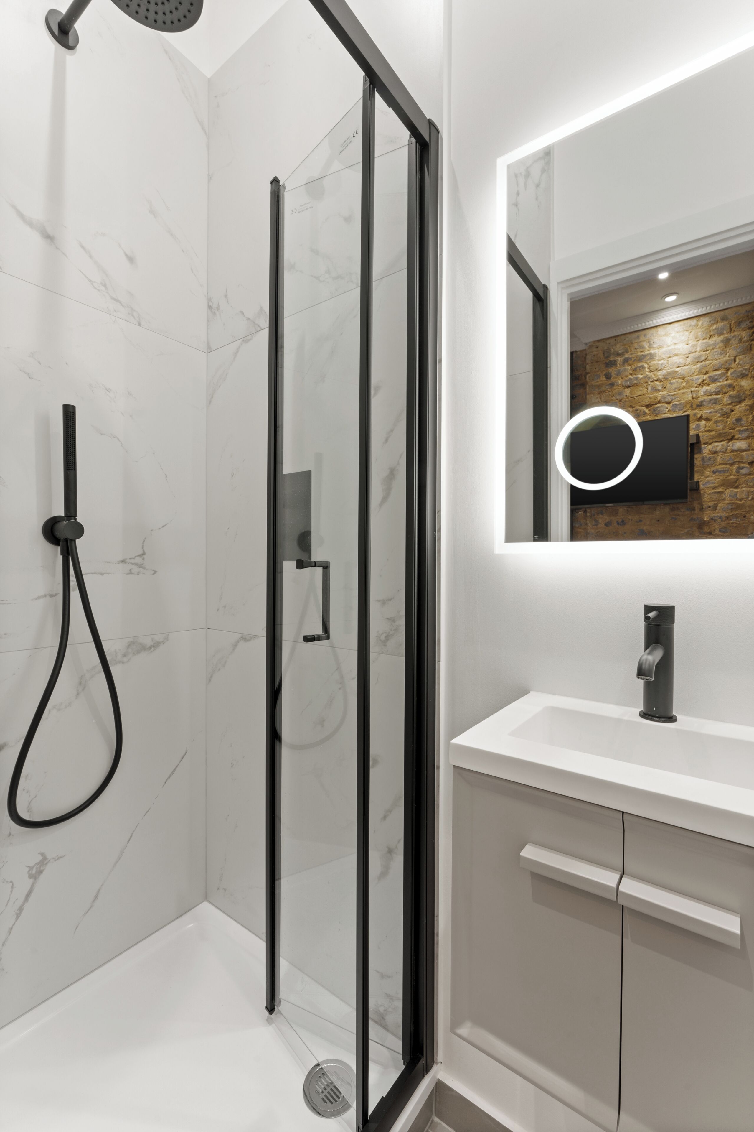 Superior Urban Studio | Bathroom | Shower, towels, soap, shampoo