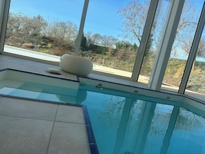 Indoor pool, seasonal outdoor pool, pool umbrellas, pool loungers