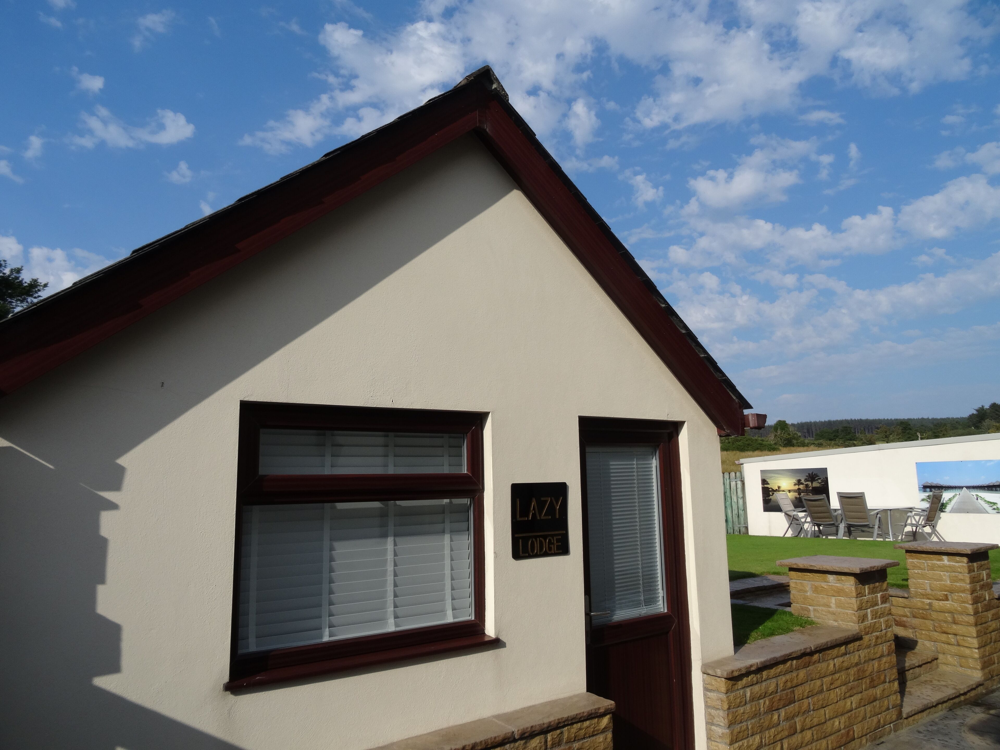 A small building with a sign reading "LAZY LODGE".