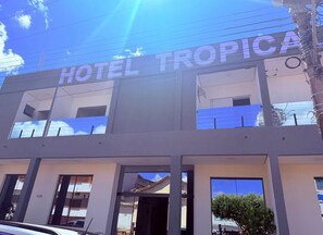 A modern hotel building with the name 'HOTEL TROPICA' prominently displayed. - Hotéis Tropical Aquidauana (Aquidauana)