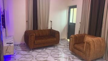 Suite Ălite, climatisation, vue ville | Coin sĂ©jour