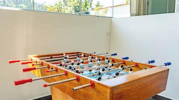 Suíte família, cozinha, vista para o pátio | Sala de jogos