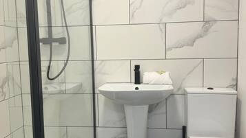 Hair dryer, towels, soap, toilet paper