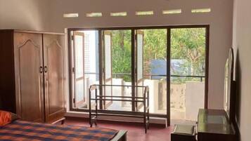 Economy House | Desk, iron/ironing board, bed sheets