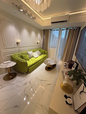 Living area - Azure Resort 2BR Deluxe Beach & Pool View with Bathtub • 8 Pax • Smart AI Toilet (Parañaque)