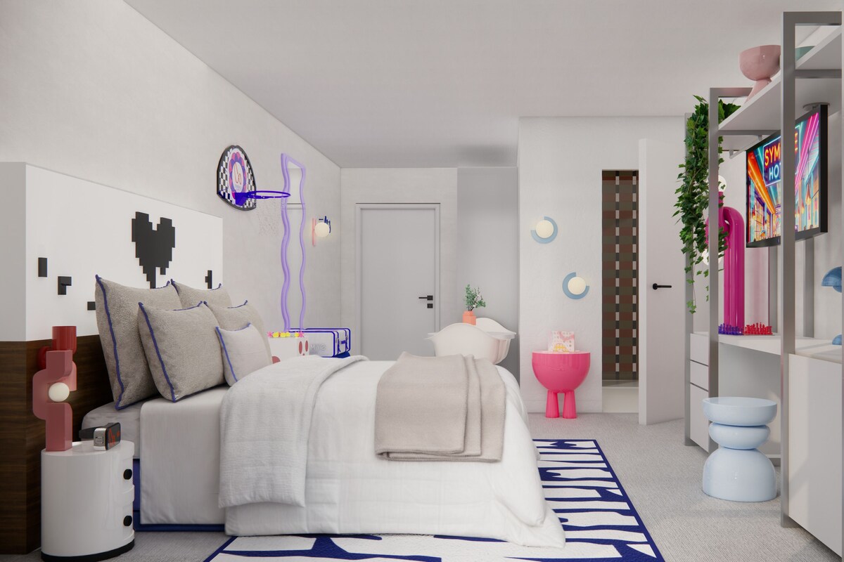 A modern bedroom with a bed, bedside table, and a wardrobe.