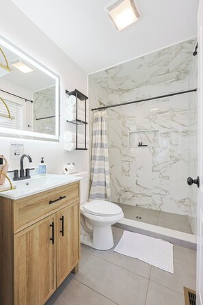 Shower, hair dryer, towels, soap