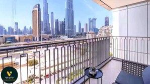 A balcony with a cityscape view, including tall buildings and a highway. - Vogue | Downtown with Direct Access to Dubai Mall (Dubai)