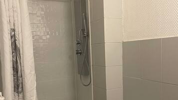 Shower, towels, toilet paper